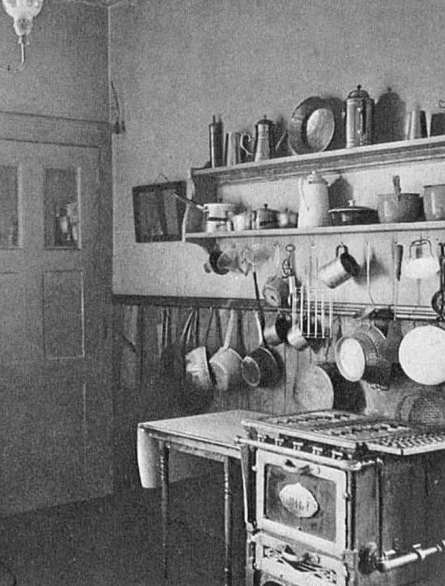Period photograph of an early 20th century kitchen where domestic workers prepared meals
