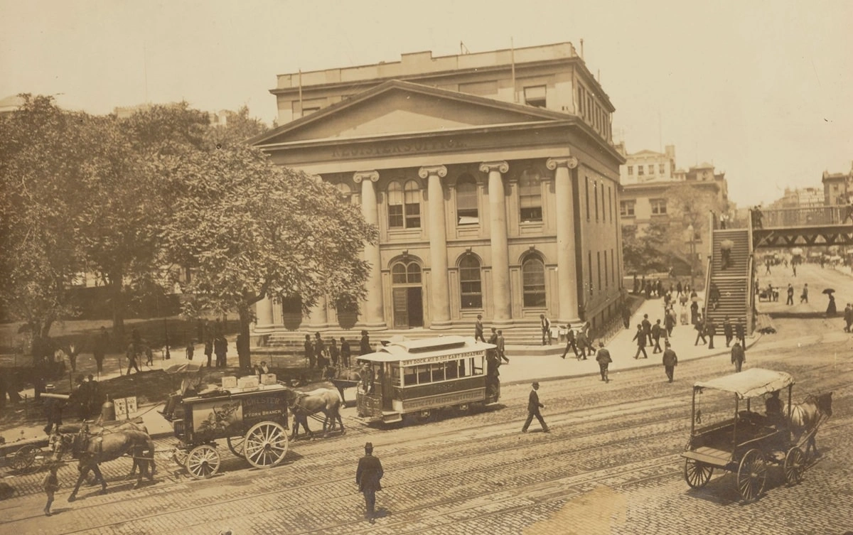 Historical photograph of New York City in the early 1900s showing crowded tenement buildings